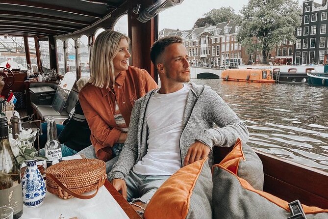 Amsterdam Small-Group Bike Tour With Canal Cruise, Drinks, Cheese - ARTIS Zoo, bridges, and changing city views