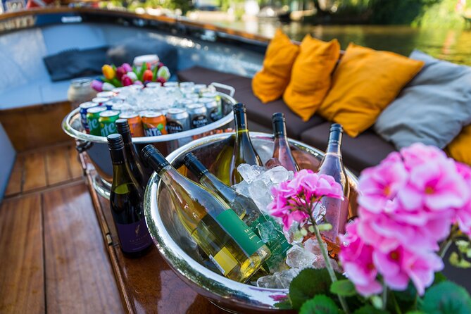 Classic Salonboat Tour in Amsterdam Including Cheese and Wine - Bridges, churches, and the Amstel