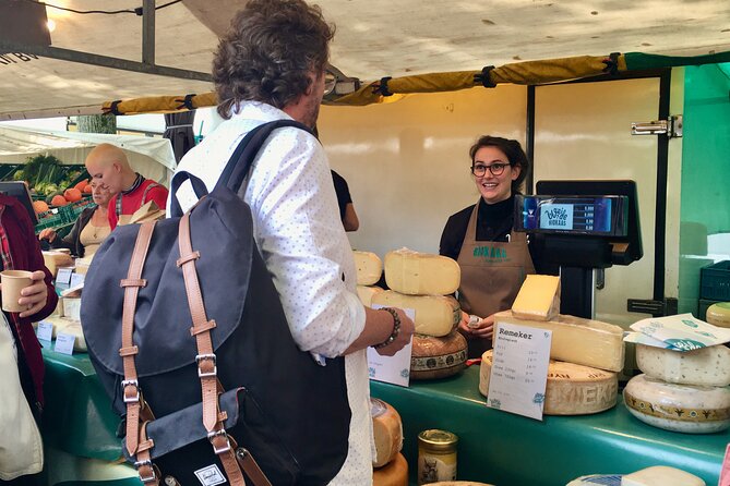 Exclusive Cheese Walk & Dutch Wine Discovery - Shopping for cheese in the Nine Streets