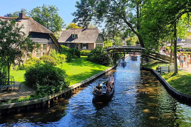 Giethoorn Day Tour from Amsterdam with Small Boat Ride - Walking beside the Giethoorn canals