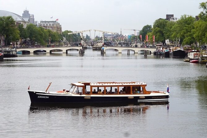 Morning Canal Cruise Amsterdam in Small-Group - A historic boat with a cozy morning feel