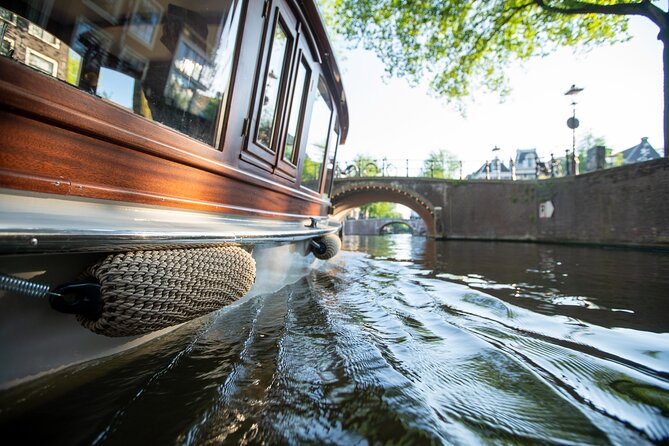 Private Boat Tour Amsterdam - 90 Min incl. welcome drink on historic saloon boat - No shore stops, but plenty to see from the water