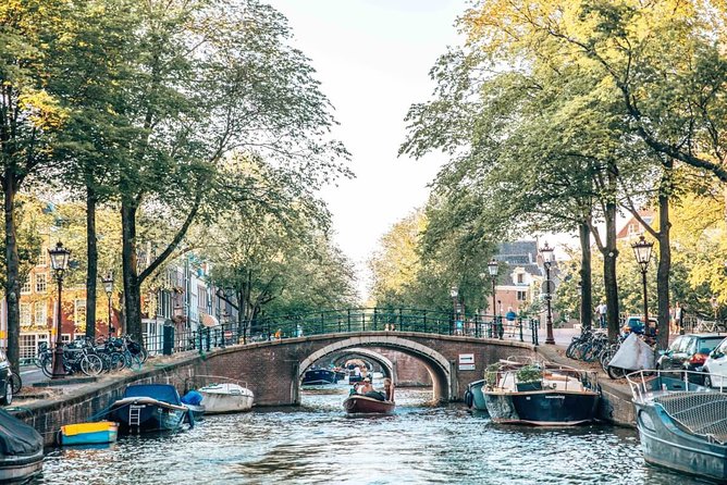 Private Romantic Canal Cruise Amsterdam with Bubbly and Snacks - Seven Bridges and the open view over the Amstel