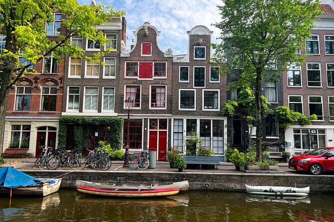 Small Group Walking Tour in Amsterdam with Friendly and Fun Guide - Jordaan: from canal workers to village atmosphere